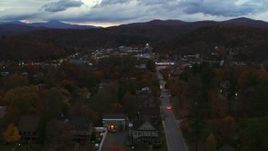 5.7K aerial stock footage of the downtown area of the city seen from homes and fall trees at twilight, Montpelier, Vermont Aerial Stock Footage | DX0002_220_052