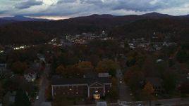 5.7K aerial stock footage of flying by the downtown area of the city seen from homes and fall trees at twilight, Montpelier, Vermont Aerial Stock Footage | DX0002_220_054