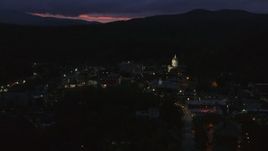 5.7K aerial stock footage of city buildings around the capitol dome lit up at twilight, Montpelier, Vermont Aerial Stock Footage | DX0002_220_064