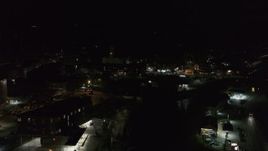 5.7K aerial stock footage of a reverse view of city buildings in downtown at night, Montpelier, Vermont Aerial Stock Footage | DX0002_221_012