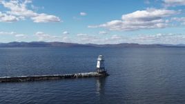 5.7K aerial stock footage orbit and fly away from a lighthouse on Lake Champlain, Burlington, Vermont Aerial Stock Footage | DX0002_222_013