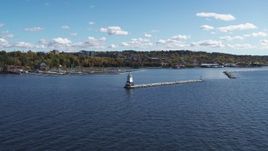 5.7K aerial stock footage of focusing on a lighthouse on Lake Champlain during descent, Burlington, Vermont Aerial Stock Footage | DX0002_222_021