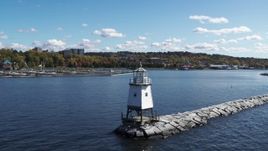 5.7K aerial stock footage approach and ascend over a lighthouse on Lake Champlain toward downtown, Burlington, Vermont Aerial Stock Footage | DX0002_222_022