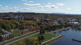 5.7K aerial stock footage of a view of downtown, seen while descending by a lakefront park, Burlington, Vermont Aerial Stock Footage | DX0002_222_025