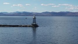 5.7K aerial stock footage flying low toward a lighthouse on Lake Champlain, Burlington, Vermont Aerial Stock Footage | DX0002_222_026