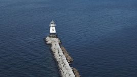 5.7K aerial stock footage circling a lighthouse at the end of a breakwater on Lake Champlain, Burlington, Vermont Aerial Stock Footage | DX0002_222_030