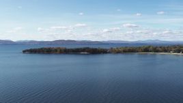 5.7K aerial stock footage of flying by a few waterfront homes on Appletree Point by Lake Champlain, Burlington, Vermont Aerial Stock Footage | DX0002_223_012