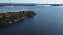 5.7K aerial stock footage of a reverse view of forest on the tip of Lone Rock Point by Lake Champlain, Burlington, Vermont Aerial Stock Footage | DX0002_223_025