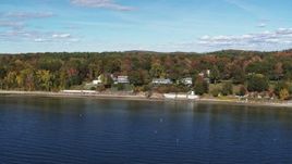 5.7K aerial stock footage of circling four beachfront homes on the shore of Lake Champlain, Burlington, Vermont Aerial Stock Footage | DX0002_223_029