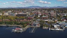 5.7K aerial stock footage of orbiting city buildings and Burlington Community Boathouse Marina in downtown, Burlington, Vermont Aerial Stock Footage | DX0002_224_003