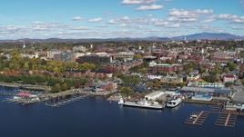 5.7K aerial stock footage reverse view of downtown buildings and marinas, Burlington, Vermont Aerial Stock Footage | DX0002_224_011