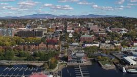 5.7K aerial stock footage ascend from marina for view of city buildings and College Street, Burlington, Vermont Aerial Stock Footage | DX0002_224_018