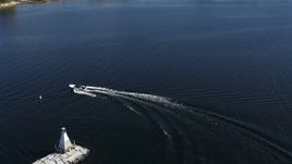 5.7K aerial stock footage of tracking a speedboat racing around a lighthouse on Lake Champlain near Burlington, Vermont Aerial Stock Footage | DX0002_224_027