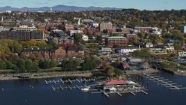5.7K aerial stock footage wide orbit office building in downtown, seen from a marina, Burlington, Vermont Aerial Stock Footage | DX0002_224_035