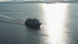 5.7K aerial stock footage tracking a ferry on Lake Champlain near the lighthouse in Burlington, Vermont Aerial Stock Footage | DX0002_224_043