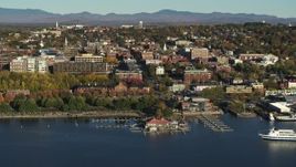 5.7K aerial stock footage of a wide orbit of city building near a marina in downtown, Burlington, Vermont Aerial Stock Footage | DX0002_224_049