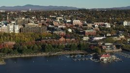 5.7K aerial stock footage approach park and city building near a marina in downtown, Burlington, Vermont Aerial Stock Footage | DX0002_224_050