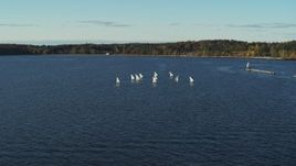 5.7K aerial stock footage flying away from and orbiting a group of sailboats on Lake Champlain, Burlington, Vermont Aerial Stock Footage | DX0002_224_055