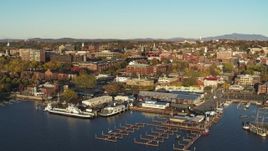 5.7K aerial stock footage descend toward marina and orbit downtown buildings, Burlington, Vermont Aerial Stock Footage | DX0002_224_068