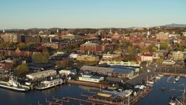 5.7K aerial stock footage orbit downtown buildings behind Lake Champlain marina, Burlington, Vermont Aerial Stock Footage | DX0002_224_072