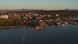 5.7K aerial stock footage of flying away from park, buildings in downtown, and a marina, Burlington, Vermont Aerial Stock Footage | DX0002_225_007