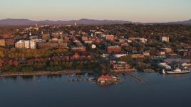 5.7K aerial stock footage orbit buildings and park in downtown behind marinas at sunset, Burlington, Vermont Aerial Stock Footage | DX0002_225_013