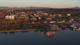5.7K aerial stock footage of buildings and park in downtown behind a marina at sunset, Burlington, Vermont Aerial Stock Footage | DX0002_225_014