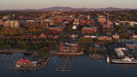 5.7K aerial stock footage fly away from downtown and a marina at sunset, Burlington, Vermont Aerial Stock Footage | DX0002_225_016