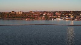 5.7K aerial stock footage fly away from downtown and Lake Champlain breakwater at sunset, Burlington, Vermont Aerial Stock Footage | DX0002_225_017