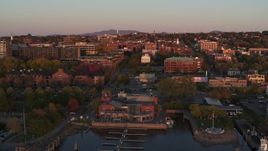 5.7K aerial stock footage a view of downtown at sunset, descend to reveal marina, Burlington, Vermont Aerial Stock Footage | DX0002_225_019
