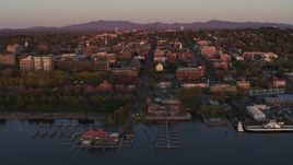 5.7K aerial stock footage ascend away from downtown and marina at sunset, Burlington, Vermont Aerial Stock Footage | DX0002_225_020