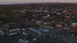 5.7K aerial stock footage an orbit around a marina and downtown office buildings at sunset, Burlington, Vermont Aerial Stock Footage | DX0002_225_023