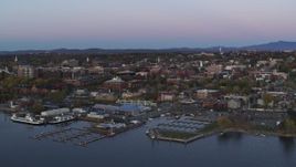 5.7K aerial stock footage of orbiting downtown buildings at twilight, reveal marina, Burlington, Vermont Aerial Stock Footage | DX0002_225_028