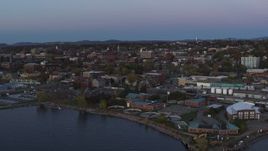 5.7K aerial stock footage reverse view of downtown buildings at twilight, Burlington, Vermont Aerial Stock Footage | DX0002_225_032