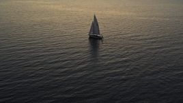 5.7K aerial stock footage approach and orbit sailboat on Lake Champlain at twilight, Burlington, Vermont Aerial Stock Footage | DX0002_225_034