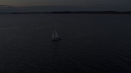 5.7K aerial stock footage of a sailboat on Lake Champlain at twilight, Burlington, Vermont Aerial Stock Footage | DX0002_225_035