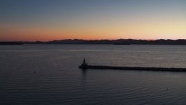 5.7K aerial stock footage stationary view of Lake Champlain lighthouse at twilight, Burlington, Vermont Aerial Stock Footage | DX0002_226_004