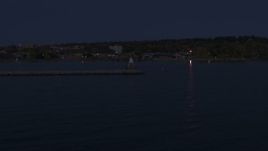 5.7K aerial stock footage of orbiting around a Lake Champlain lighthouse at night, Burlington, Vermont Aerial Stock Footage | DX0002_226_007