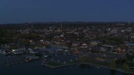 5.7K aerial stock footage reverse view of city's downtown area at twilight, reveal marina, Burlington, Vermont Aerial Stock Footage | DX0002_226_014