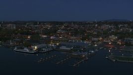 5.7K aerial stock footage descend past the city's downtown area and a marina at night, Burlington, Vermont Aerial Stock Footage | DX0002_226_020
