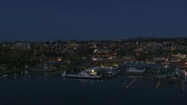 5.7K aerial stock footage fly away from the city's downtown area and a marina at night, Burlington, Vermont Aerial Stock Footage | DX0002_226_021