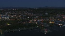 5.7K aerial stock footage focus on the city's downtown area lit up for the night while flying away, Burlington, Vermont Aerial Stock Footage | DX0002_226_025