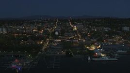 5.7K aerial stock footage focus on the city's downtown area lit up for the night, fly away from marinas, Burlington, Vermont Aerial Stock Footage | DX0002_226_028