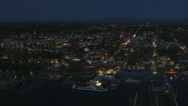 5.7K aerial stock footage focus on the city's downtown area lit up for the night, seen from marinas, Burlington, Vermont Aerial Stock Footage | DX0002_226_029