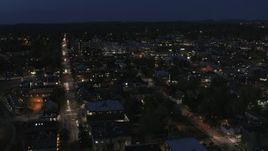 5.7K aerial stock footage fly away from and orbit the downtown area lit up for nighttime, Burlington, Vermont Aerial Stock Footage | DX0002_226_032