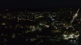 5.7K aerial stock footage circling the downtown area and College Street lit up for nighttime, Burlington, Vermont Aerial Stock Footage | DX0002_226_034