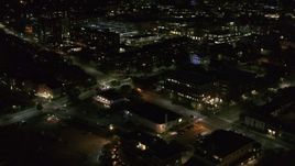 5.7K aerial stock footage orbit office buildings on Battery Street lit up for nighttime, Burlington, Vermont Aerial Stock Footage | DX0002_226_037