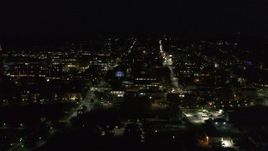 5.7K aerial stock footage of slowly orbiting office buildings and streets in downtown lit up for nighttime, Burlington, Vermont Aerial Stock Footage | DX0002_226_041
