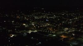 5.7K aerial stock footage of approaching downtown office buildings from the lake at nighttime, Burlington, Vermont Aerial Stock Footage | DX0002_226_046