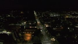 5.7K aerial stock footage of following Battery Street by office buildings in downtown at night, Burlington, Vermont Aerial Stock Footage | DX0002_226_052